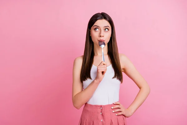 Portrait of her she nice-looking attractive lovely winsome cute pretty dreamy funny shy straight-haired girl licking spoon counting calories isolated over pink pastel color background — Stock Photo, Image