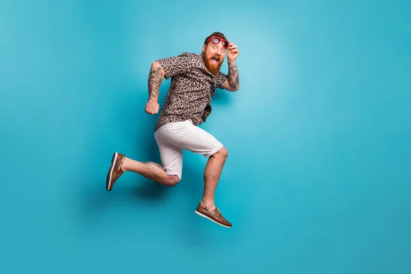 Full length body size view of his he nice attractive crazy funky overjoyed cheerful cheery man jumping running fast isolated over bright vivid shine vibrant blue color background — Stock Photo, Image