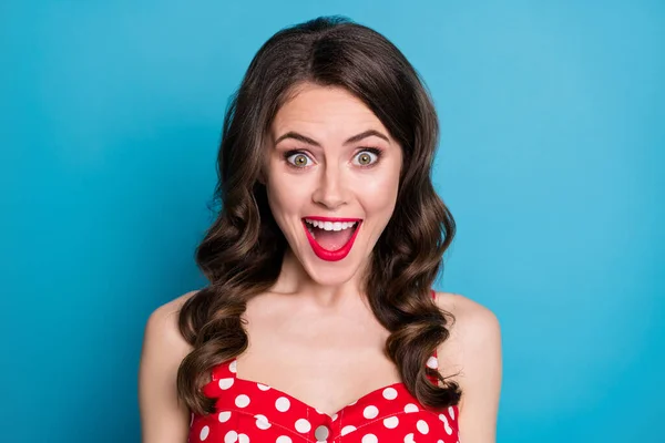 Closeup photo of pretty funny wavy lady open mouth excited listen good news overjoyed expression crazy wear red dotted dress singlet isolated blue color background — Stock Photo, Image