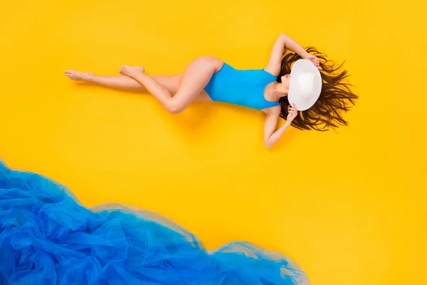 Top view above high angle flat lay flatlay koncepcja full length body size view of fit thin gorgeous girl taking sun bath summer time isolated bright vivid shine vibrant yellow color background — Zdjęcie stockowe