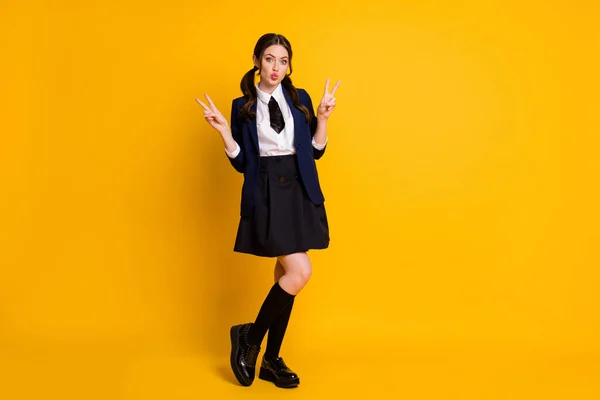 Full size photo of dream dreamy high school girl have university class day make v-sign send air kiss wear good look uniform shoes isolated over bright shine color background — Stock Photo, Image