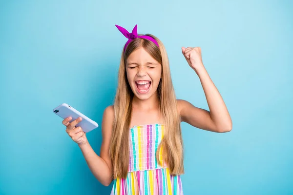 Close-up portrait of her she nice attractive cute crazy cheerful cheery long-haired girl using device celebrating luck success isolated over bright vivid shine vibrant blue color background — Stock Photo, Image