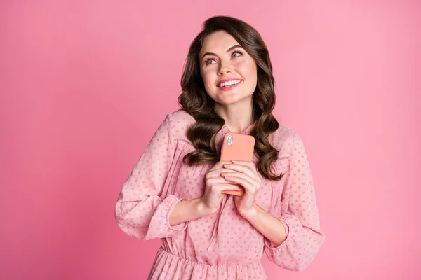 Portrait of positive cheerful girl hold smartphone impressed followers subscribers like her blog enjoy look copyspace isolated over pastel color background — Stock Photo, Image