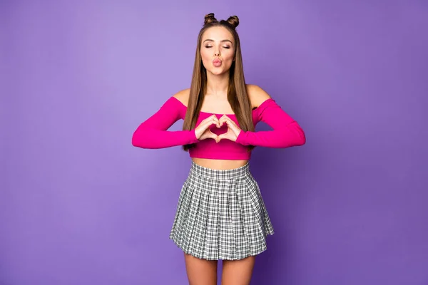 Photo of adorable attractive lady making heart shape fingers send kisses wear pink off-shoulders cropped top short plaid skirt isolated pastel purple color background — Stock Photo, Image