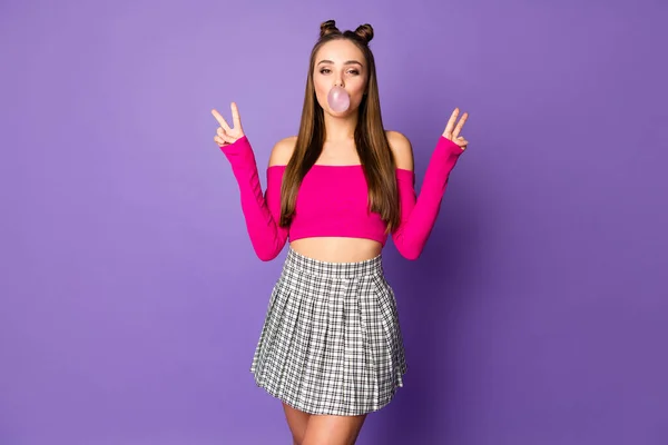 Photo of pretty funny lady two pretty buns blowing bubble gum showing v-sign symbols wear pink off-shoulders cropped top plaid skirt isolated pastel purple color background — Stock Photo, Image