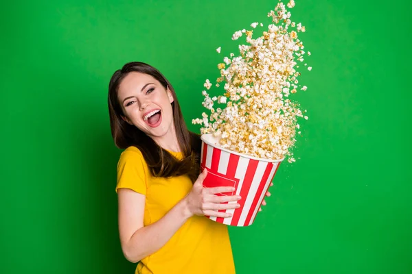 Portrait of her she nice-looking attractive pretty lovely cheerful cheery straight-haired girl eating throwing corn having fun isolated on bright vivid shine vibrant green color background — Stock Photo, Image