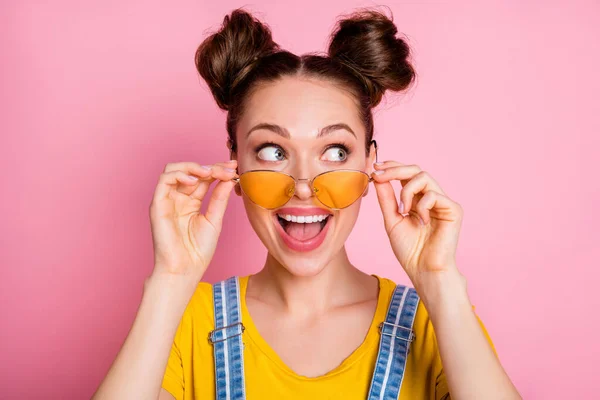 Close-up portrait of her she nice-looking attractive lovely pretty funky cheerful cheery glad brown-haired girl touching specs incredible good news sale isolated over pink pastel color background — Stock Photo, Image