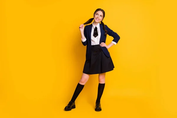 Full length body size view of her she nice attractive pretty charming cute dreamy cheerful cheery schoolgirl learning fantasizing isolated on bright vivid shine vibrant yellow color background — Stock Photo, Image