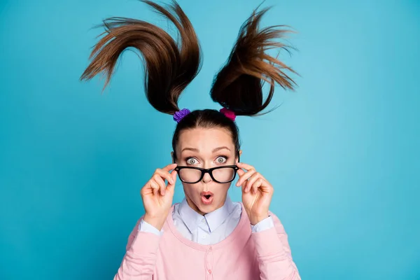 Portrait of astonished girl touch hands spectacles impressed graduation exam news haircut air fly wear pastel sweater isolated over blue color background — Stock Photo, Image