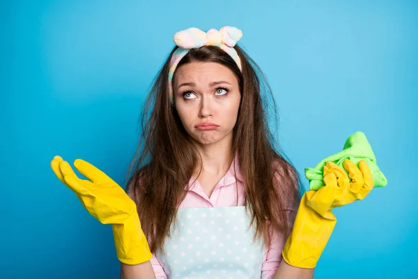 Close-up portrait of her she nice attractive moody gloomy grumpy frustrated worried girl maid mess messy hair tired boring job isolated over bright vivid shine vibrant blue color background