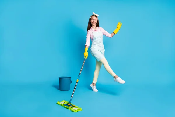 Full length body size view of her she nice attractive professional cheerful cheery girl maid cleansing rubbing floor tidy neat dancing isolated over bright vivid shine vibrant blue color background — Stock Photo, Image