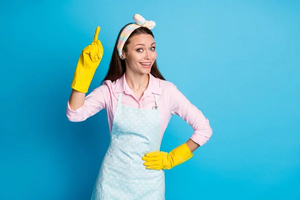Portrait of her she nice attractive lovely smart clever cheerful cheery girl washer maid pointing forefinger up tidy neat isolated over bright vivid shine vibrant blue color background