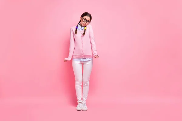 Full length body size view of her she nice attractive pretty cute shy smart smart brown-haired girl geek standing shrugging shoulders isolated over pink pastel color background — стоковое фото