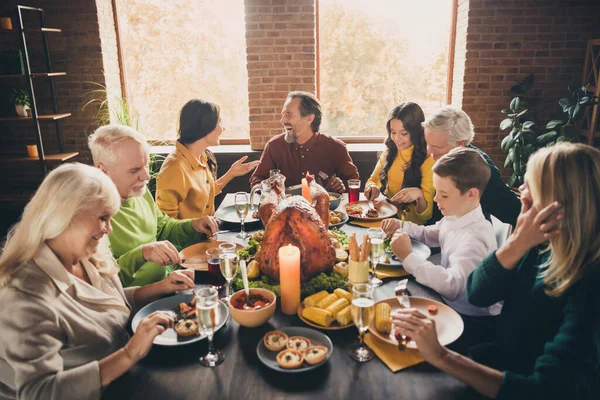 Portrait of nice attractive cheerful cheery positive glad family parents grandparents eating harvest tradition celebratory festive autumn fall at modern loft industrial brick interior house — Stock Photo, Image