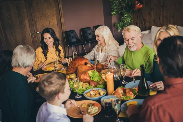 Portrait of nice attractive adorable cheerful family small little kids enjoying eating tasty yummy domestic turkey harvest festal luncheon at modern loft industrial wooden interior house indoors — Stock Photo, Image