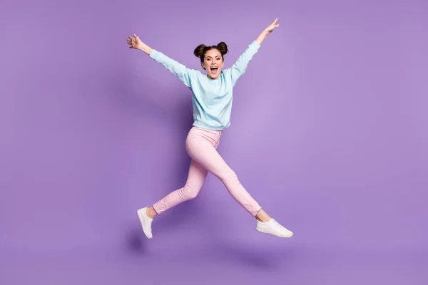 Full length body size view of nice attractive slim ecstatic cheerful funny girl jumping having fun running isolated on violet purple lilac bright vivid shine vibrant color background — стоковое фото