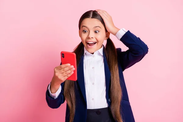 Portrait of her she nice attractive cheerful addicted small little girl using device app 5g like follow subscribe watching browsing multimedia isolated over pink pastel color background — Stock Photo, Image