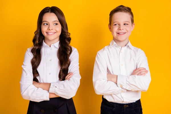 Portrait of her she his he nice attractive cheerful cheery smart clever pupils folded arms new academic year autumn fall season isolated over bright vivid shine vibrant yellow color background — Stock Photo, Image