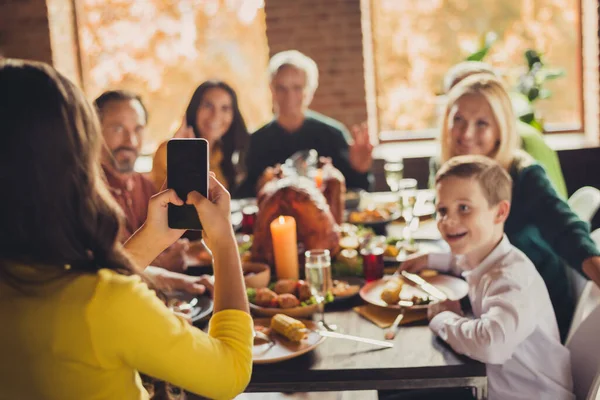 Photo of family meeting served table thanks giving dinner little girl hold telephone make portrait living room indoors — Stock Photo, Image