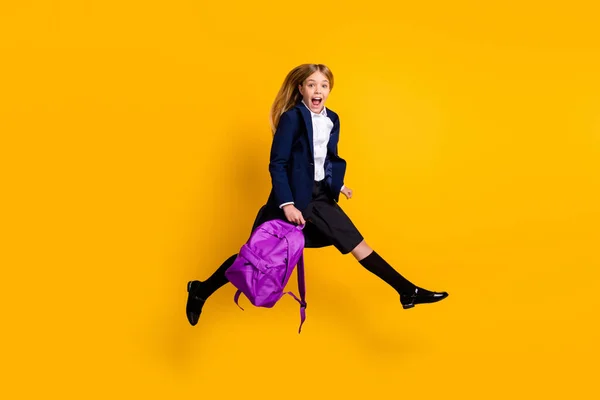 Full length body size view of her she small cheerful funky girl jumping running fast rush lesson classes isolated bright vivid shine vibrant yellow color background — стоковое фото