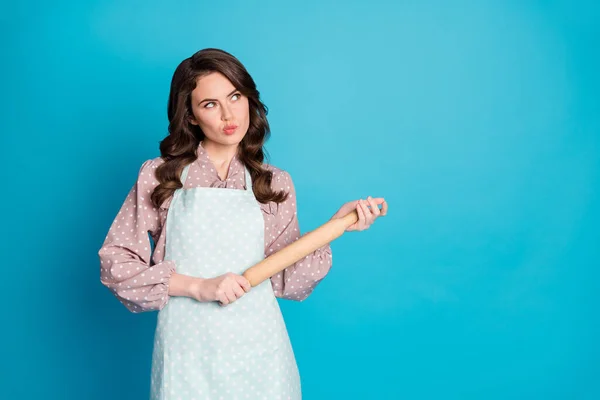 Portrait of minded pensive girl look copyspace think thoughts decide what tasty delicious recipe bakery bake wear polka-dot clothes isolated over blue color background — Stock Photo, Image