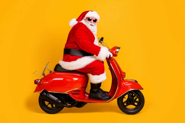 Profile side view of his he nice funny fat thick white-haired Santa jazda motocykl podróż zjazd Eve Noel wizyta zakupy sprzedaż odizolowanych jasny żywy połysk żywy żółty kolor tło — Zdjęcie stockowe