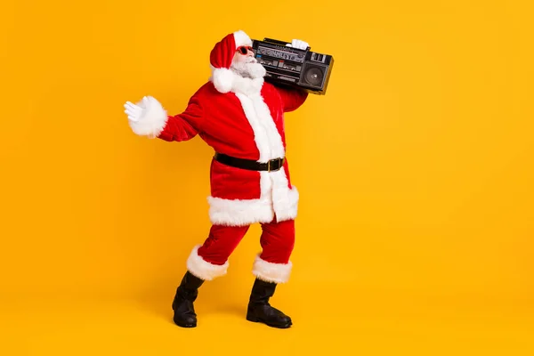 Full length body size view of his he nice funny positive thick white-haired Santa dj mc carrying cassette tape boombox dancing having fun isolated bright vivid shine vibrant yellow color background — Stock Photo, Image