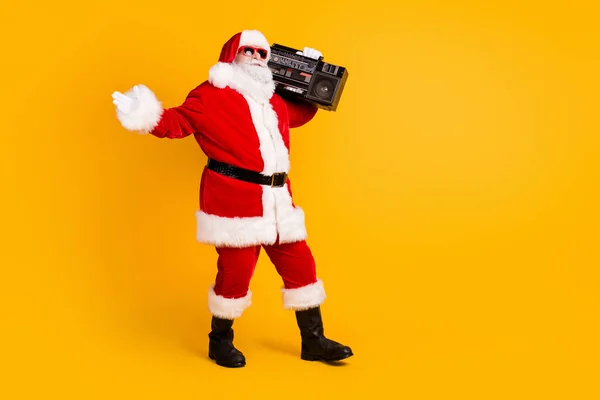 Full length body size view of his he nice funny funky thick white-haired Santa dj mc deejay carrying boombox dancing rest isolated bright vivid shine vibrant yellow color background — Stock Photo, Image