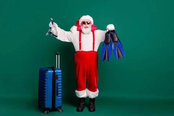 Full length body size view of his he nice handsome bearded funky cheerful overweight fat Santa holding in hands floating equipment air flight ocean resort isolated over green color background — Stock Photo, Image