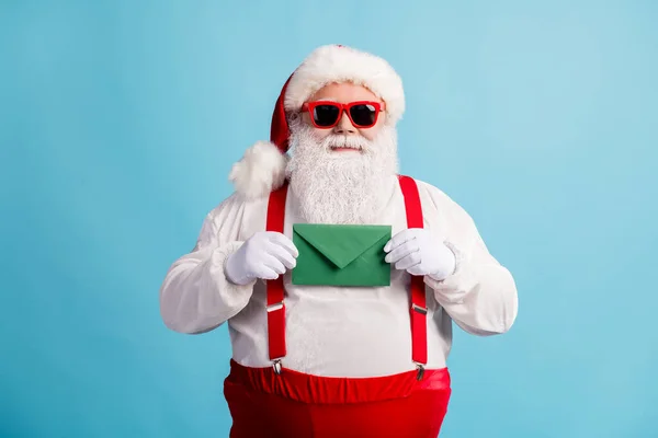 Portrait of his he nice attractive cheery confident overweight white-haired Santa holding in hands letter wish list fairy tradition isolated bright vivid shine vibrant blue color background — Stock Photo, Image