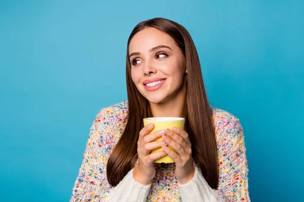 Closeup photo of cute attractive lady long hairdo stay home quarantine enjoy hot favorite coffee beverage look side empty space wear casual sweater isolated blue color background — Stock Photo, Image