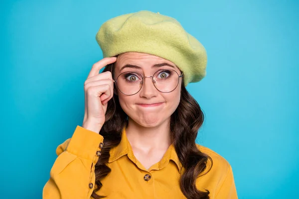 Portrait of unaware ignorant girl have difficult question cant find answer scratch finger forehead wear good look outfit isolated over blue color background