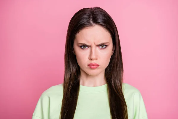 Closeup photo of attractive offended lady straight long hairdo look moody facial expression annoyed wear casual green sweatshirt pullover isolated pink pastel color background — Stock Photo, Image