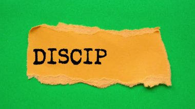 Discipline message written on ripped torn paper background. Conceptual Discipline symbol.