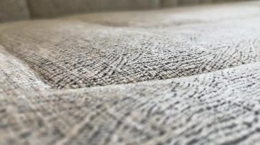 Close up textured sofa fabric surface with detailed upholstery pattern