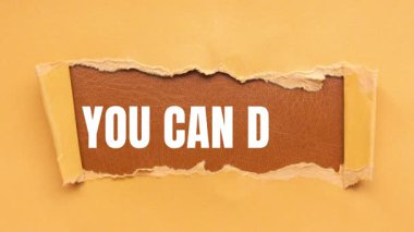 You Can Do It message written on ripped torn paper background. Conceptual You Can Do It symbol.