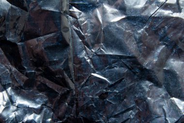 Buruşuk yansıtıcı parlak hediye paketleme malzemesi dokusu arka planı