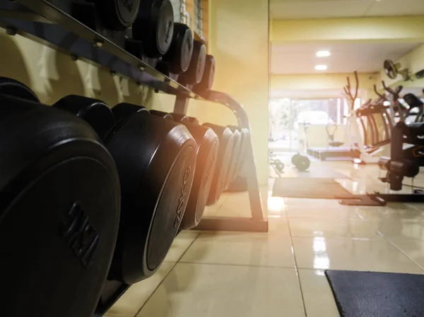 Sports dumbbells in modern sports club. Weight Training Equipment