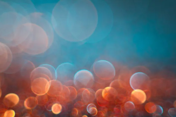 Abstractie oranje bokeh op een blauwe achtergrond. Intreepupil. — Stockfoto