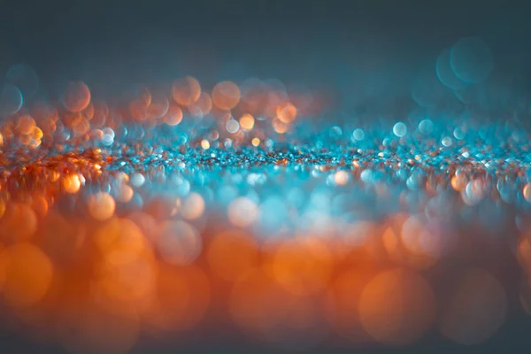 Abstraction orange bokeh on a blue background. Defocused. — Stock Photo, Image