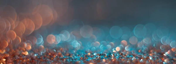 Mavi bir arka plan üzerinde soyutlama turuncu bokeh. Defocused.