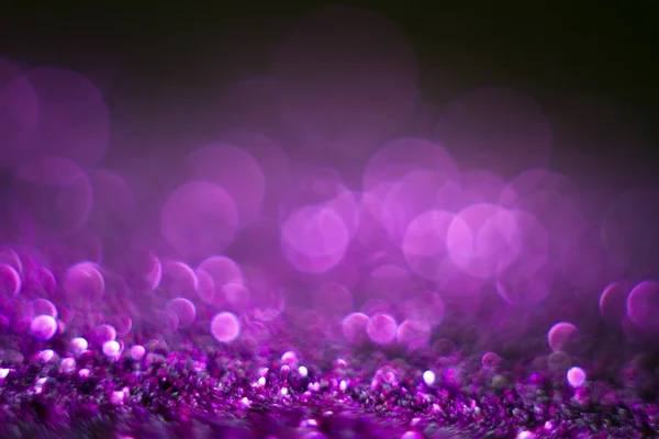 Violet bokeh on a black background. Defocused. Abstract background for your design. Free space for text. — Stock Photo, Image