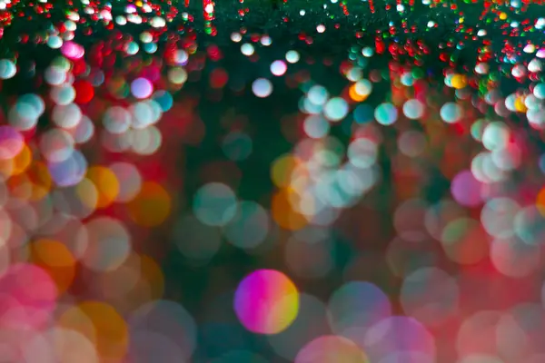 Abstraction colorful bokeh on a dark background. Defocused. — Stock Photo, Image