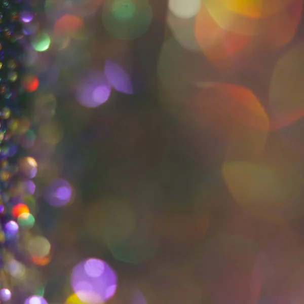 Abstraction colorful bokeh on a dark background. Defocused. — Stock Photo, Image