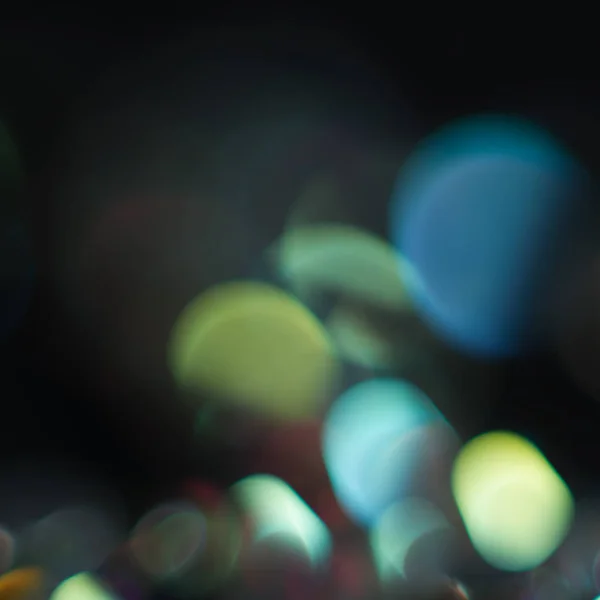 Abstractie kleurrijke bokeh op een donkere achtergrond. Intreepupil. — Stockfoto