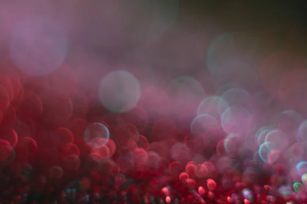 Abstract red bokeh on a black background. Defocused. — Stock Photo, Image