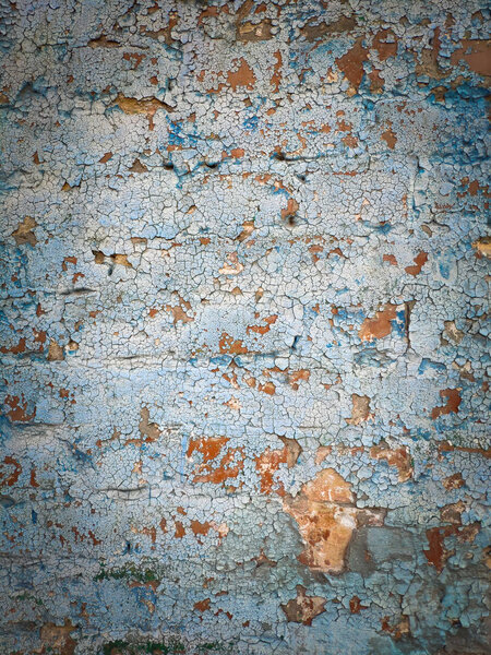 Concrete wall cracked paint, paint abstractly behind the concrete. Texture, pattern, background. old paint. With white tone paint flakes off over time