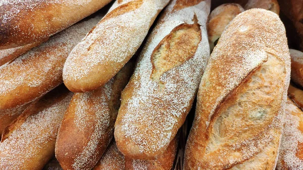 Closeup of beautiful baked baguette with brown crisp on the shop window