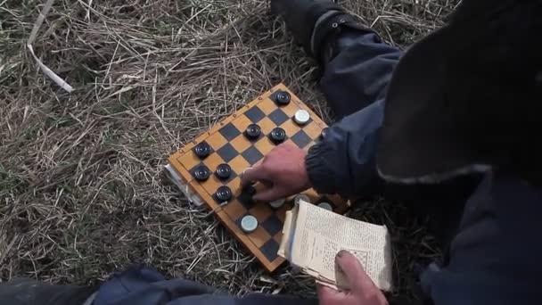 Old Man Messy Clothes Sits Hill Playing Checkers Grazing Flock — Stock Video