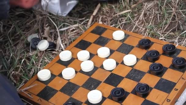 Closeup Old Hands Playing Checkers According Scheme Newspaper Nature Shepherd — Stock Video